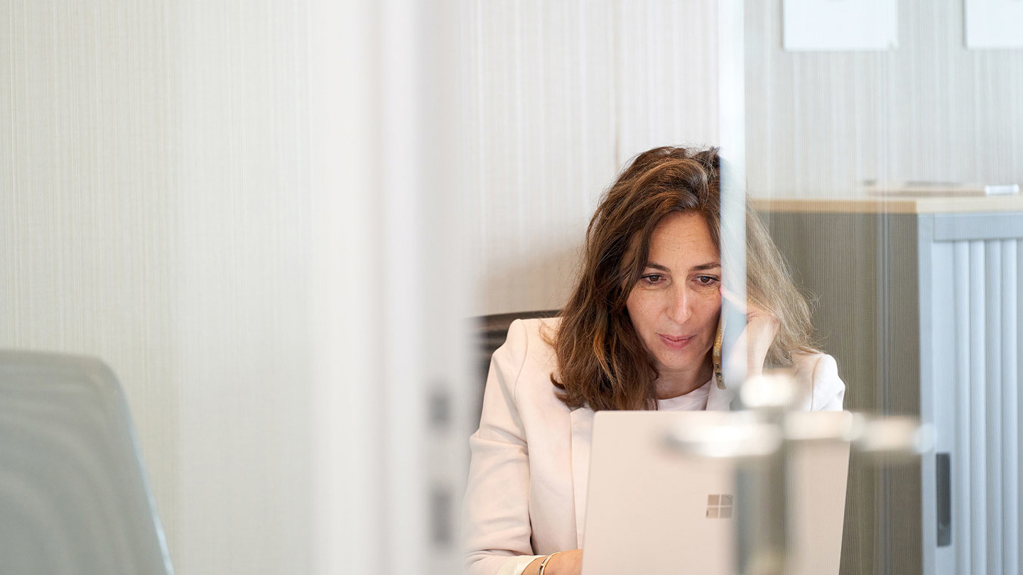 Woman looking at her laptop