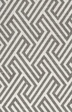 a gray and white rug with an intricate design