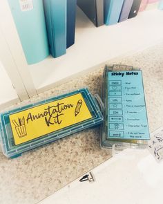 an annotation kit sits on the counter next to some binders and books