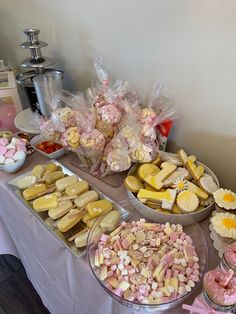 a table topped with lots of different types of candy and candies on top of it