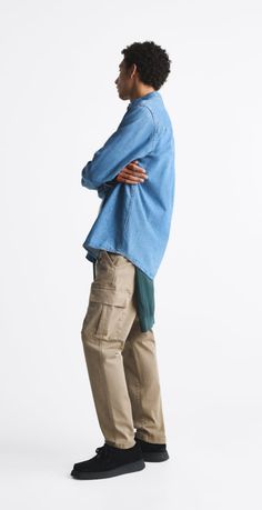 a man standing with his arms crossed