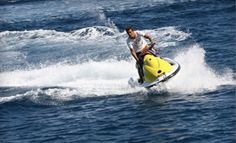 a man on a surfboard in the water