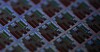 Macro Shot of a Silicon Wafer with Computer Chips during Manufacturing Process at Fab or Foundry. Semiconductor Wafer Texture.