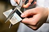 Person cutting up their payment card