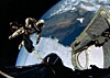 Ed White floating in space above the earth viewed through the hatch of Gemini 4 (pic: NASA)