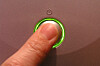 Finger pushes power button