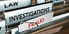 A folder of paperwork labeled fraud
