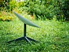 A SpaceX Starlink dish in a garden