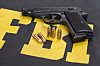 The FBI text next to a gun and some bullets