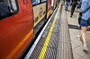 The iconic Mind The Gap floor signage of the London Underground