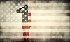 A military serviceman saluting the USA flag