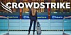 Woman at delayed airport with the CrowdStrike logo over it