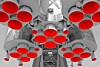 Stylized rocket engines in black and white with red engine cones