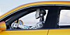 Robot driving a car