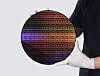 Man holding a semiconductor wafer manufactured using IBM's new sub-1 nm process