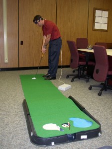 EEG modulated golf trainer