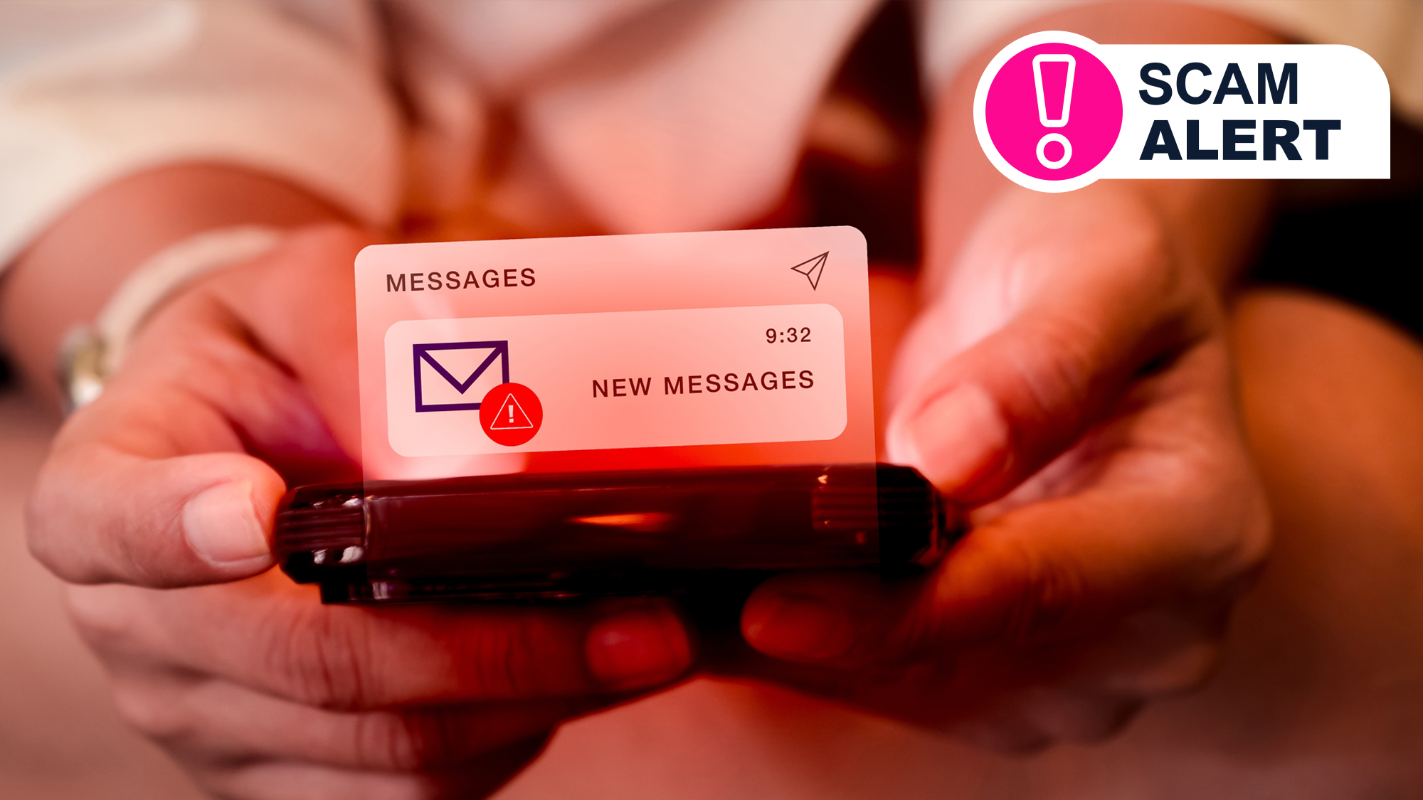 Two hands holding a phone in red lighting showing a scam text message