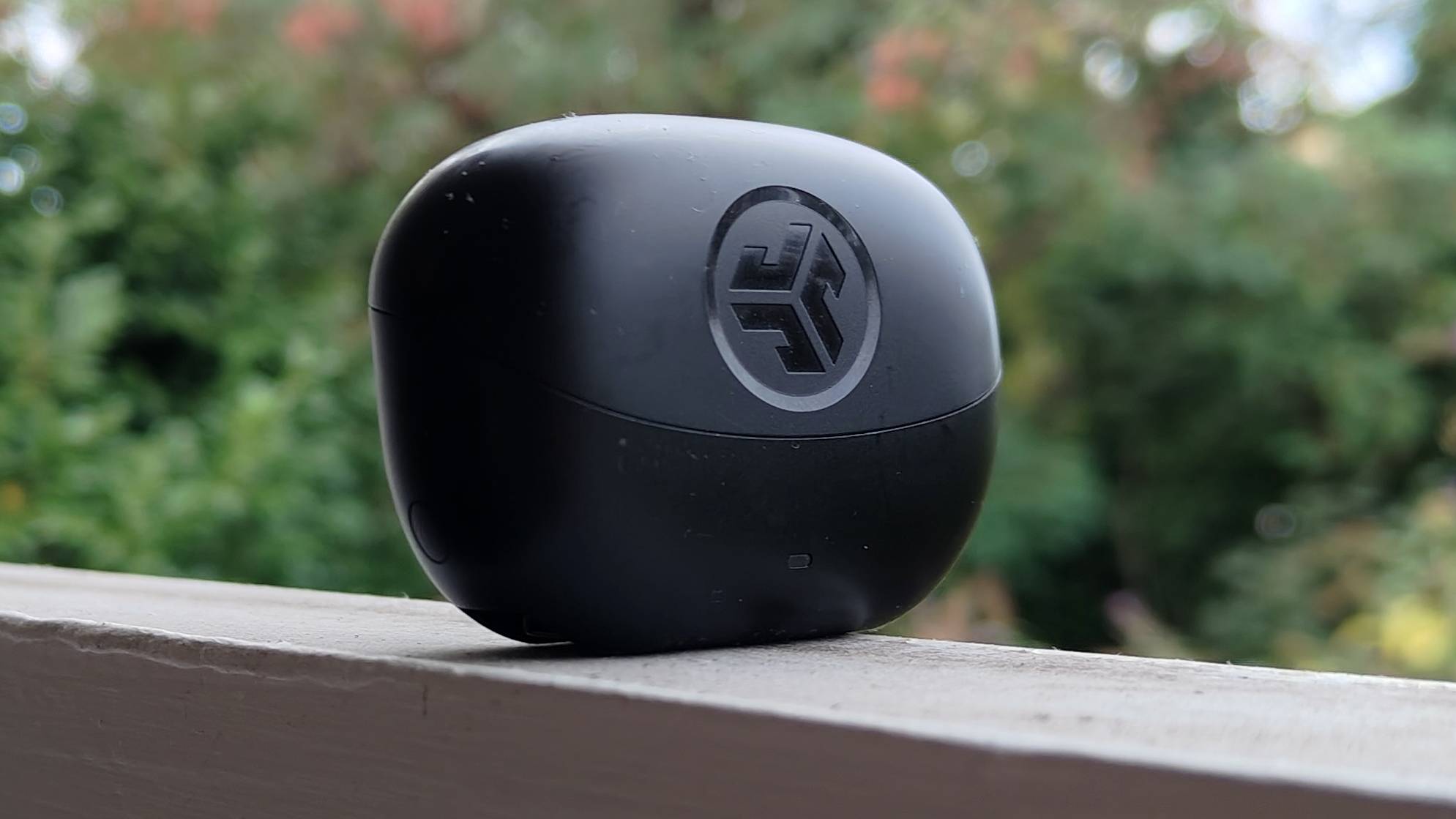 The JLab Go Pods ANC on a window sill.