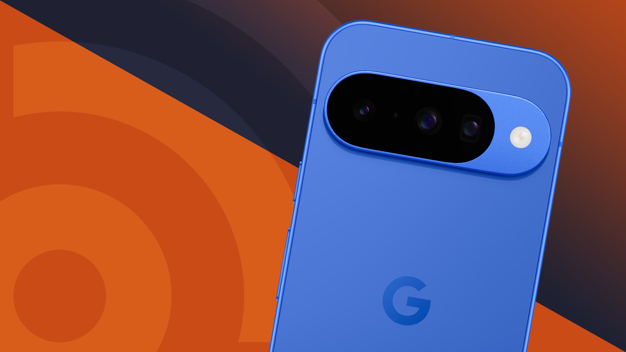 Google Pixel 10 in Indigo blue showing the back cameras and Google G logo on an orange TechRadar logo background, tilted to the right at a slightly jaunty angle