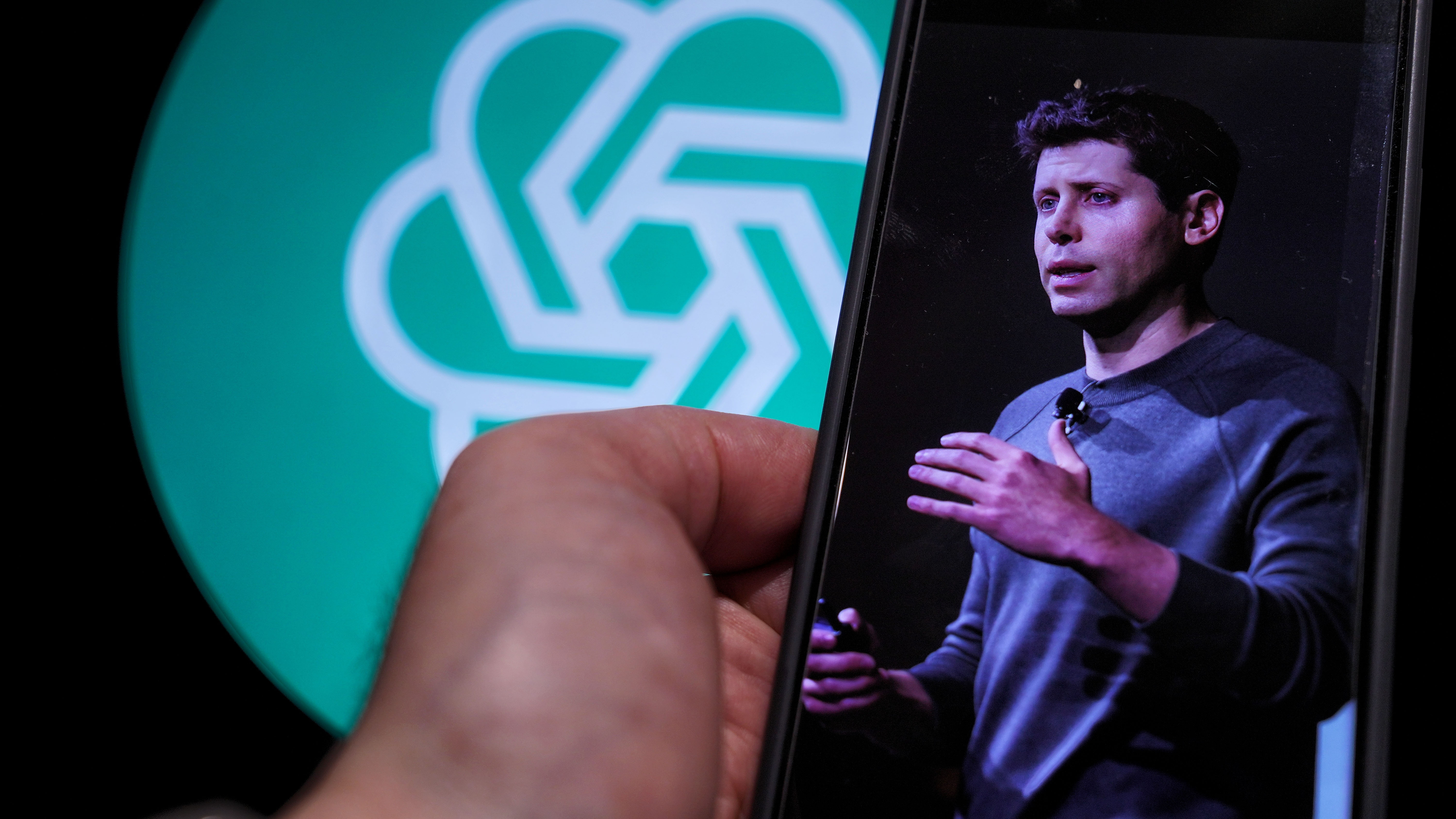 Sam Altman and ChatGPT logo.