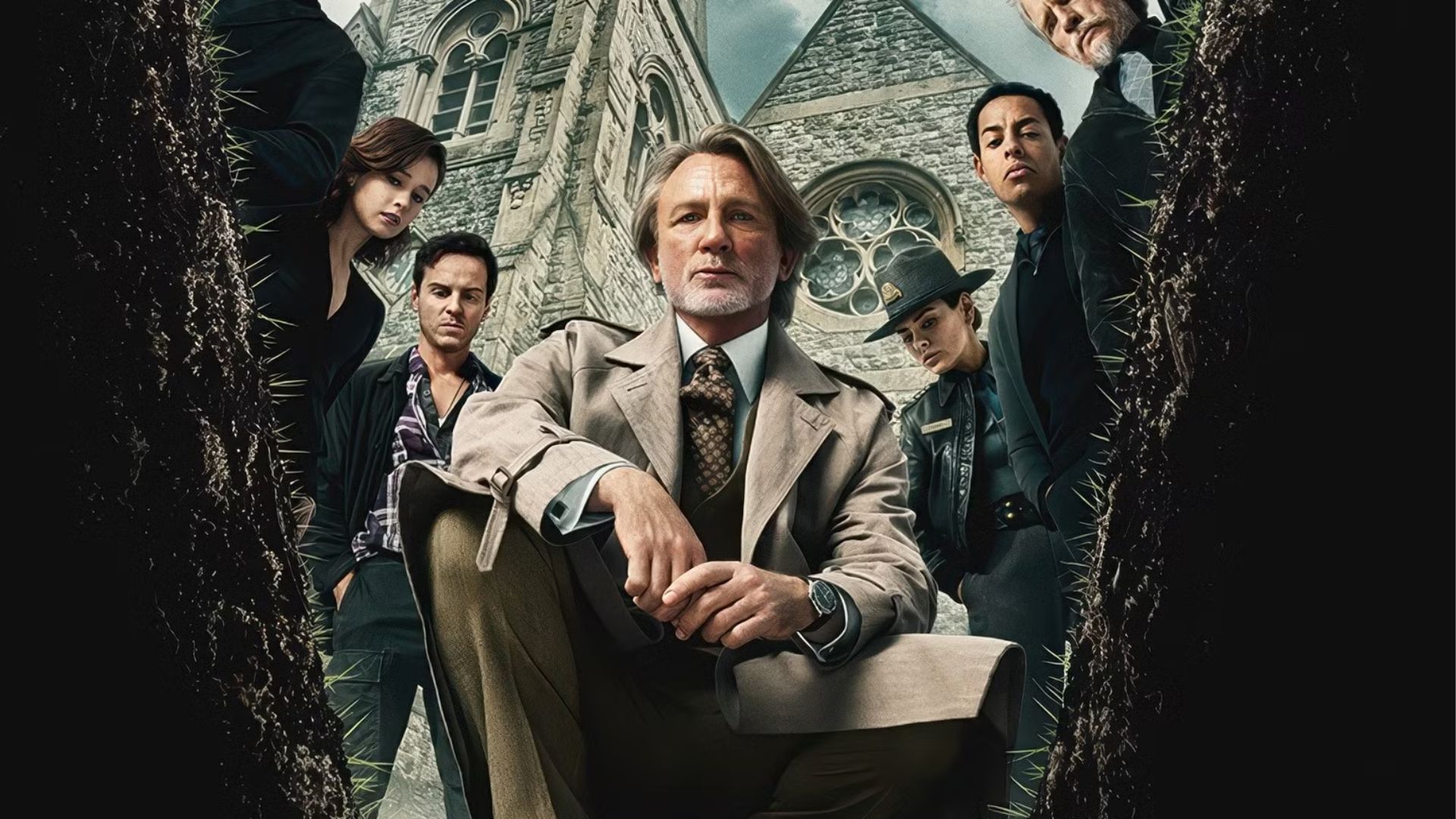 The cast of Wake Up Dead Man look into a grave