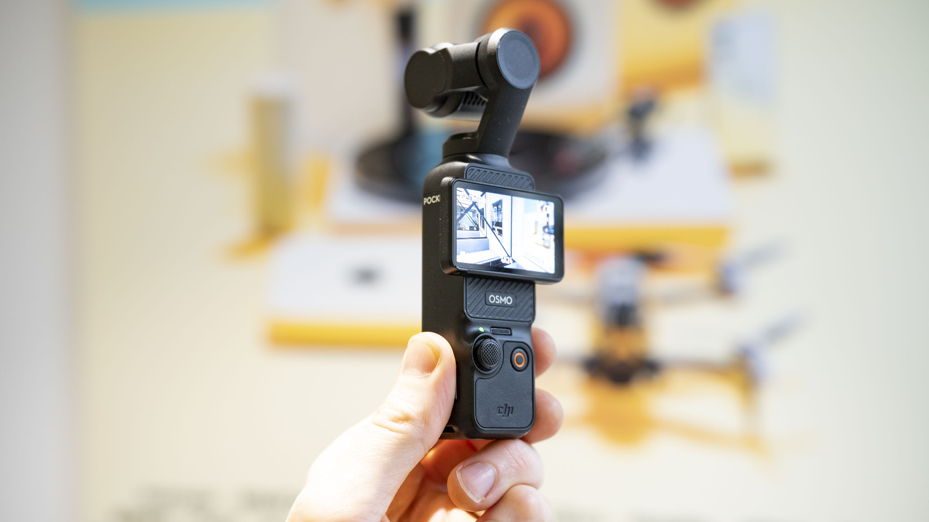 DJI Osmo Pocket 3 vlogging camera in user's hand