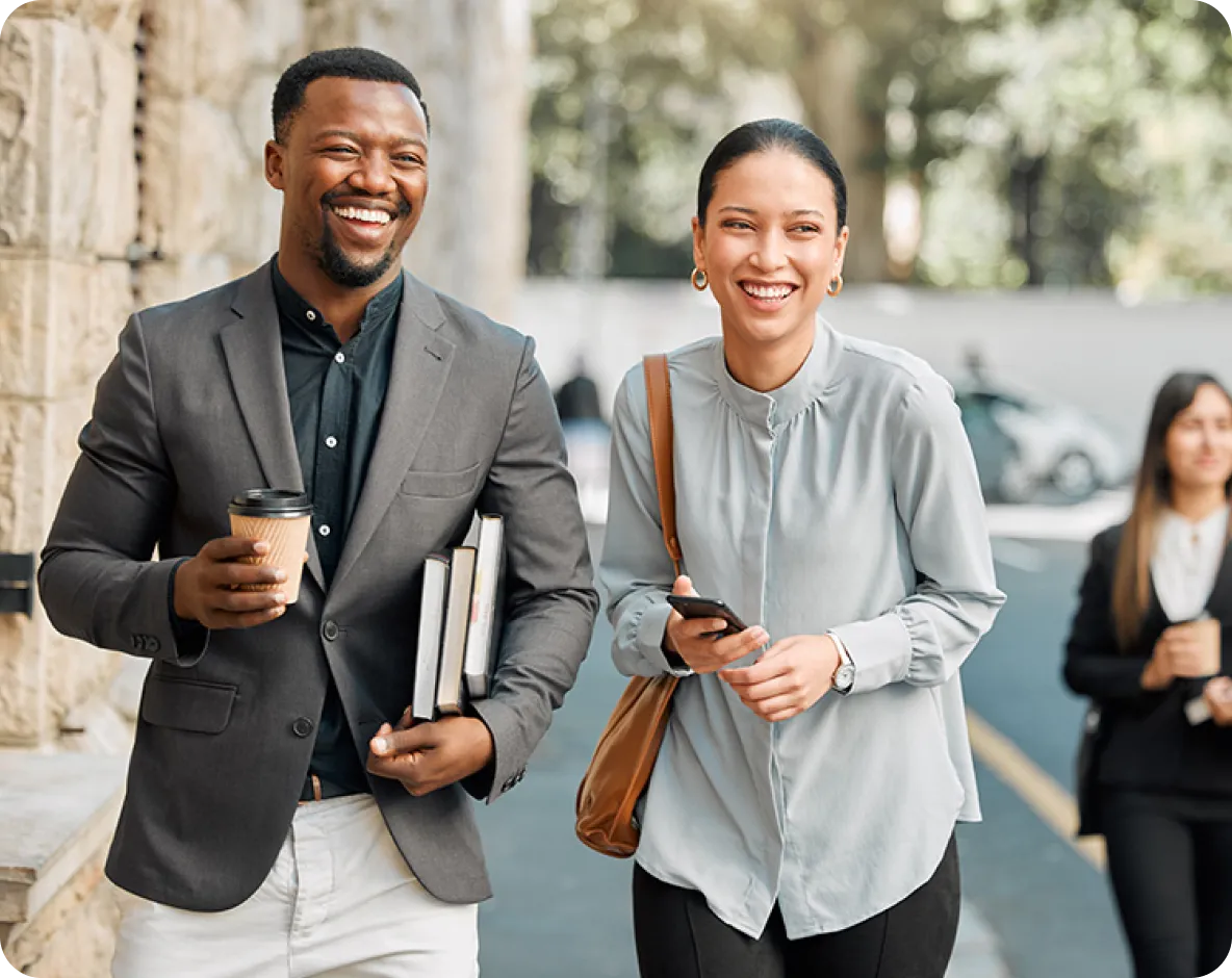 Smiling professionals walking on the street