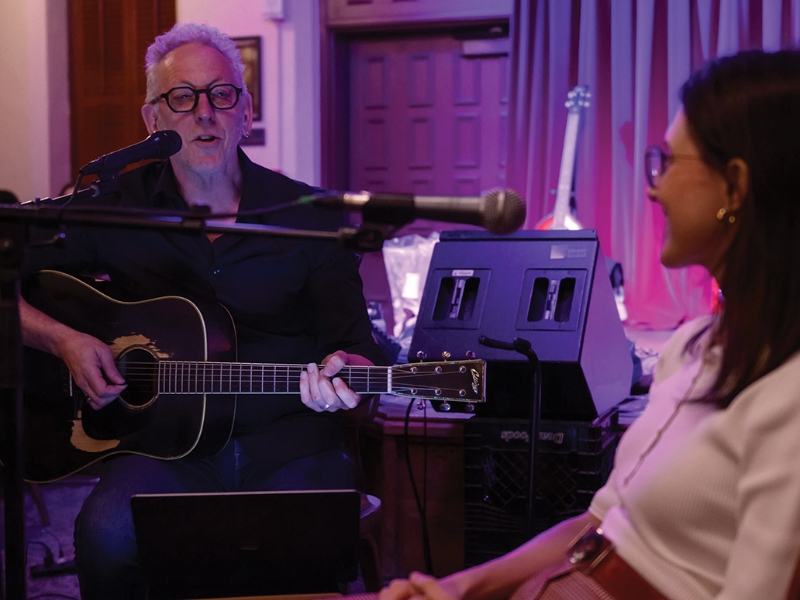 Darden Smith playing guitar and singing in recording studio