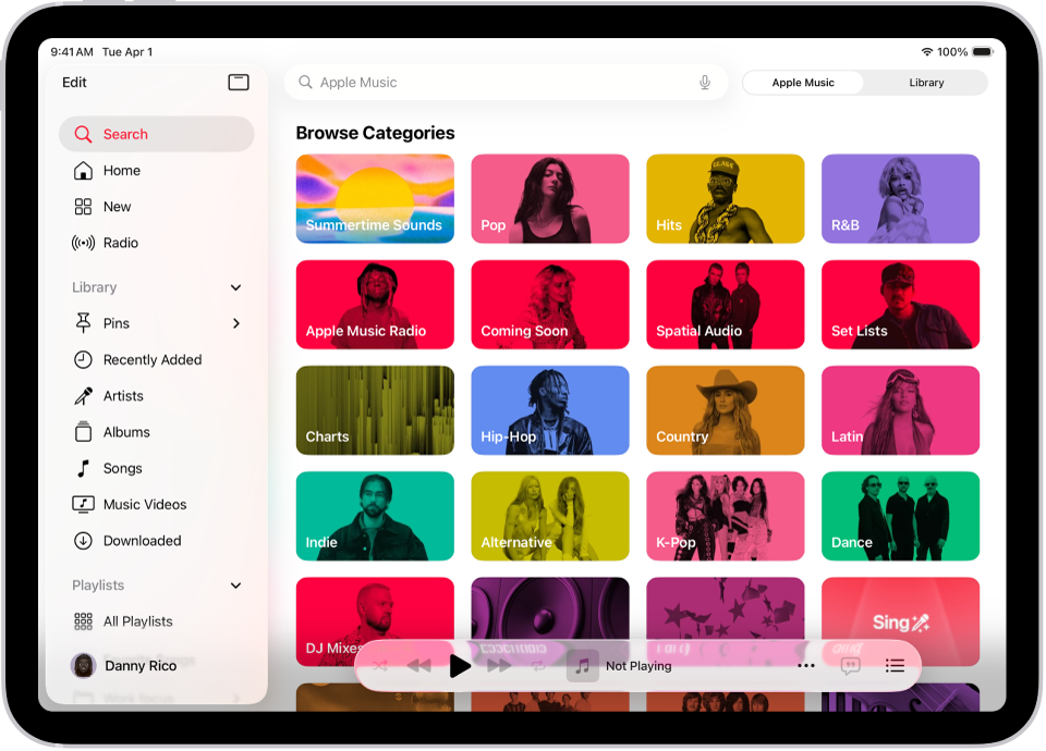 Der Tab „Suchen“ mit der Seitenleiste links und einem Suchfeld oben. Unter dem Suchfeld werden verschiedene Musikkategorien anzeigt. Unten befindet sich der Mini-Player.