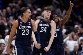 UConn v Duke Braylon Mullins #24 celebrates with Jayden Ross #23 and Malachi Smith #0 of the UConn Huskies after Mullins shot the game-winning three point basket during the second half of a game against the Duke Blue Devils in the Elite Eight of the 2026 NCAA Men's Basketball Tournament at Capital One Arena on March 29, 2026 in Washington, DC. (Photo by Patrick Smith/Getty Images)