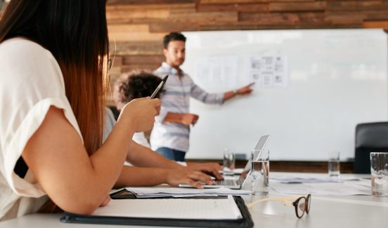 Closeup,Image,Of,Young,Woman,Sitting,In,A,Meeting,In