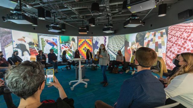 Student showcasing their final project in the Visualization Studio 