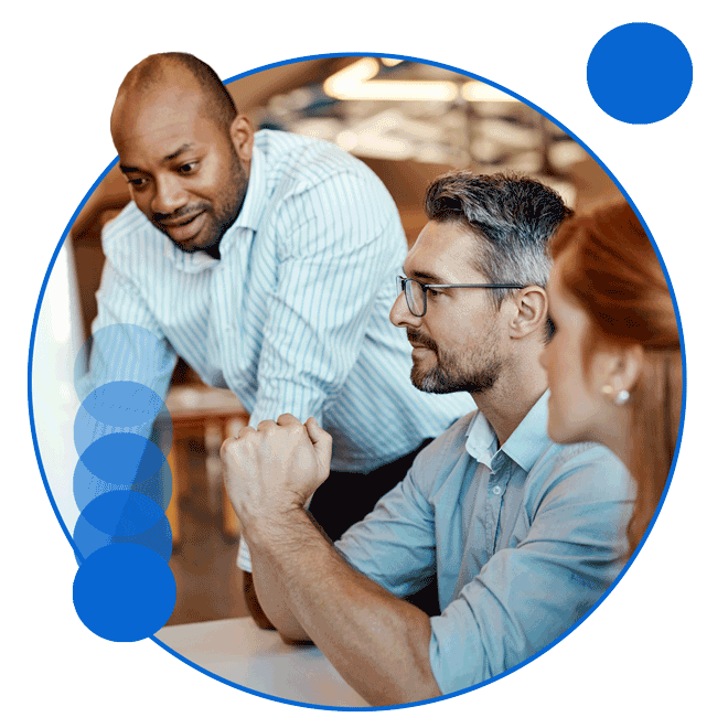Three diverse coworkers collaborating to solve problem