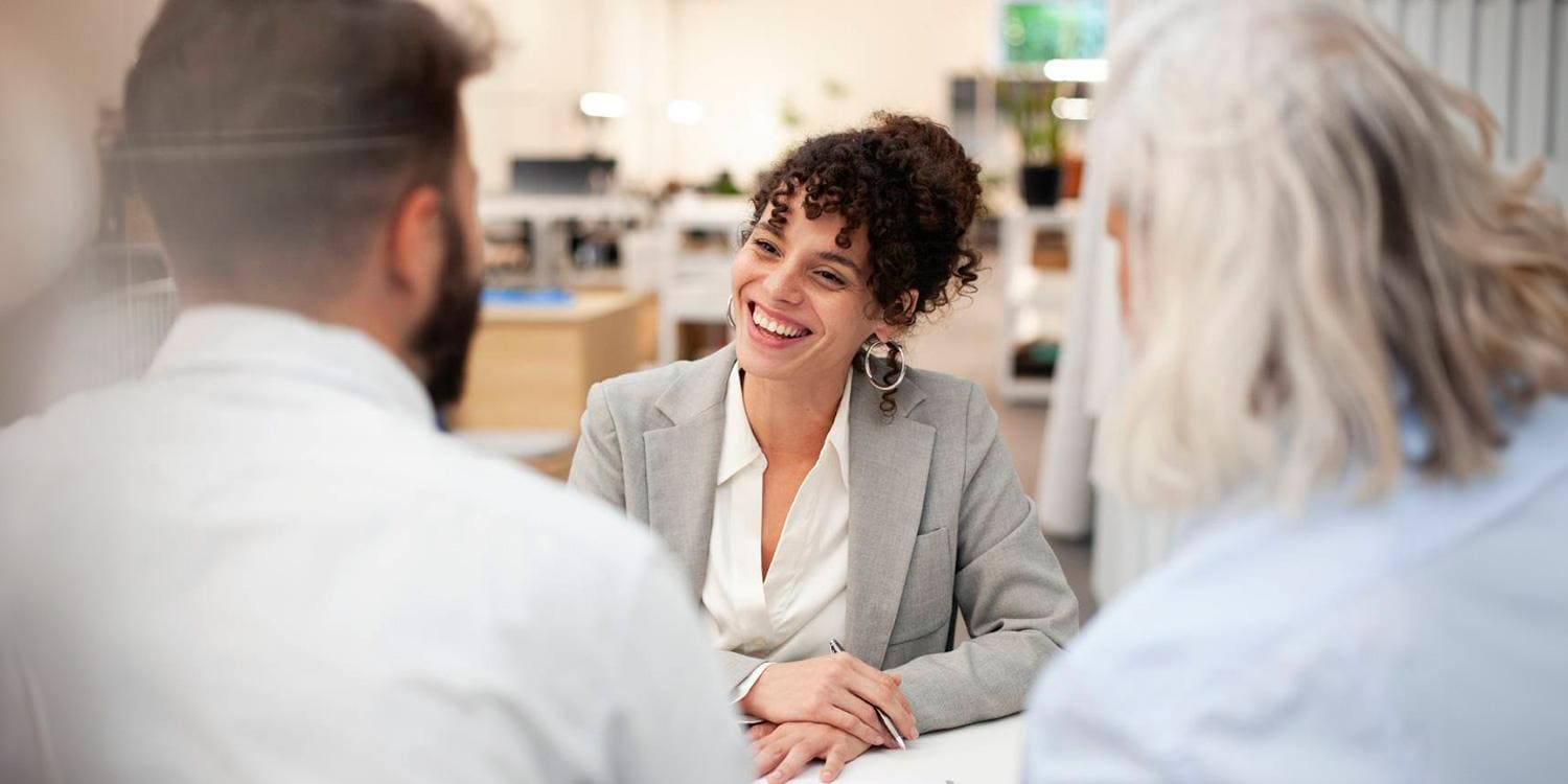 Banking Analytics Smiling woman meeting with two people