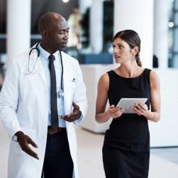 Doctors talking in hallway of hospital