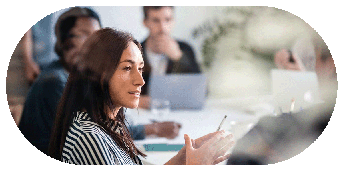 Businesswoman speaking with colleagues in a meeting