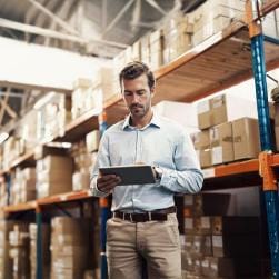 Man using tablet in warehouse